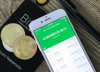 Wallet für Bitcoins: Das müssen Sie wissen Smartphone mit Bitcoin-Wallet